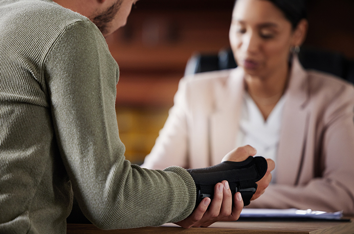 A human resources professional speaks with an injured worker about Workers' Compensation. Workers' compensation is a vital protection both for workers and employers. The market for this coverage is generally stable, though challenges are on the horizon. Alera Group can help.